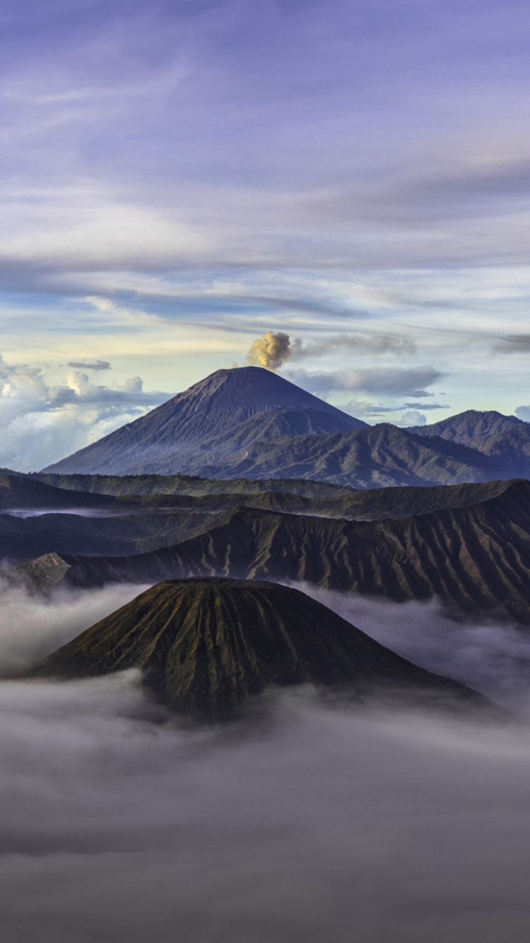 Black and White Mountain Under White Clouds. Wallpaper in 750x1334 Resolution