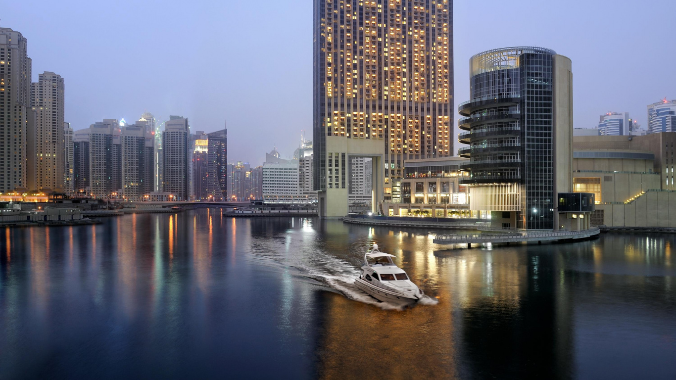 White and Black Boat on Water Near City Buildings During Night Time. Wallpaper in 1366x768 Resolution