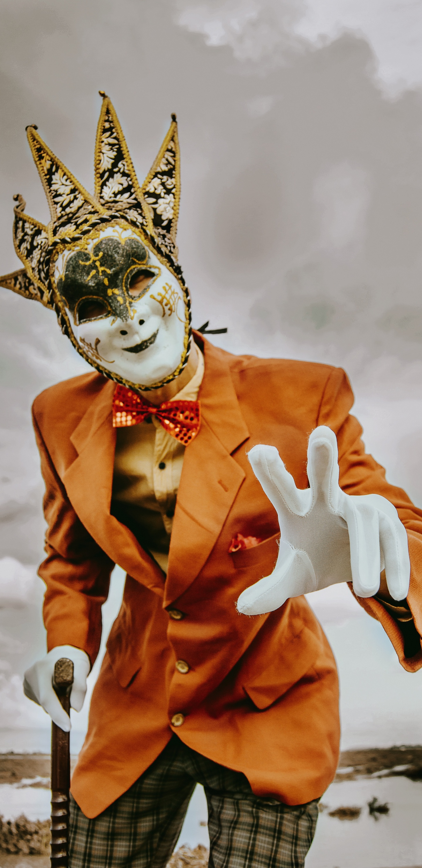 Person in Orange Suit With White Mask. Wallpaper in 1440x2960 Resolution
