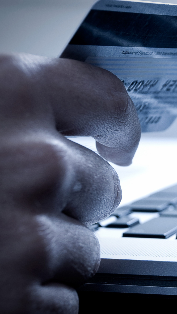 Grayscale Photo of Person Using Laptop Computer. Wallpaper in 750x1334 Resolution