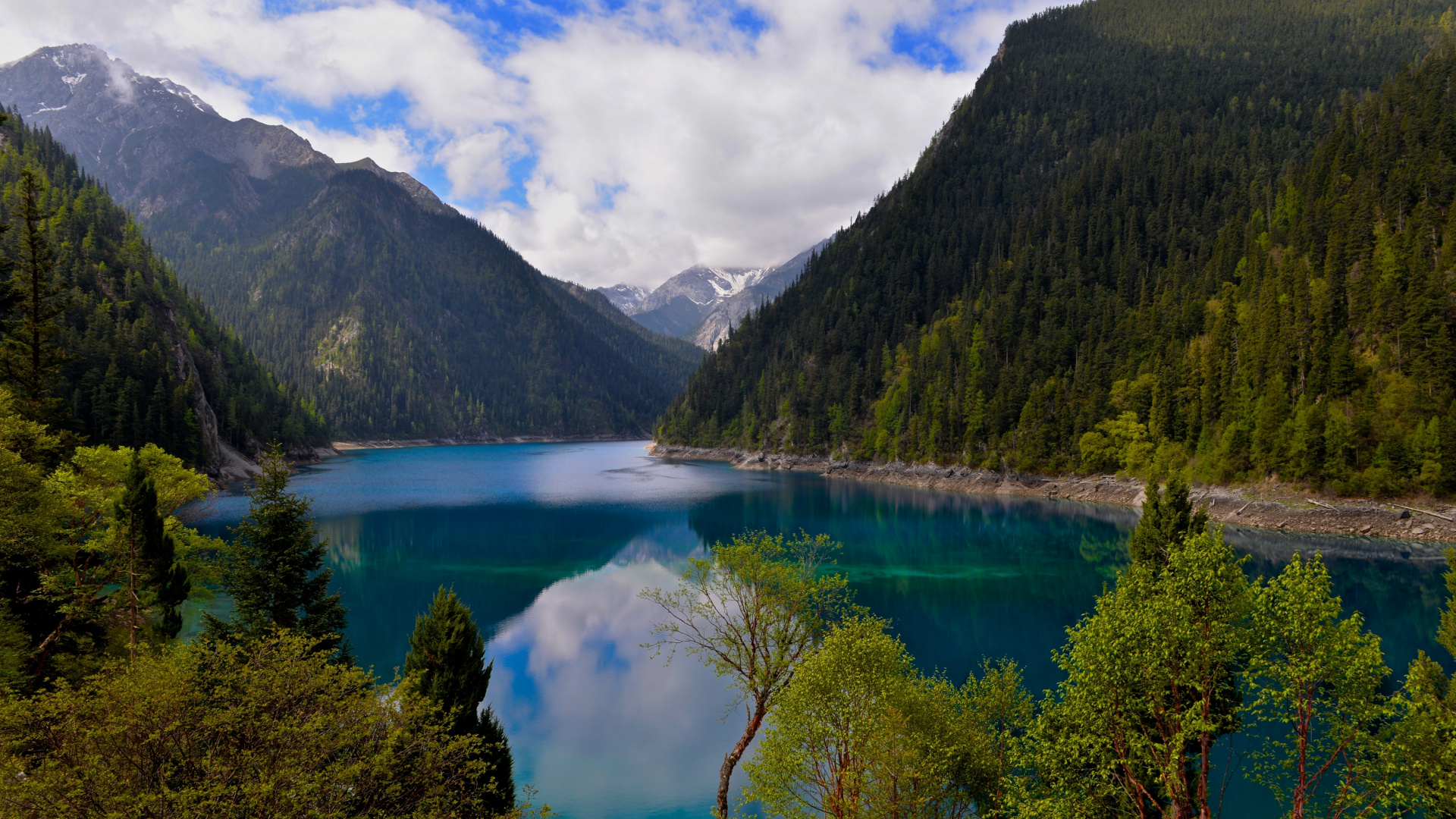 Green Mountains Beside Lake Under Blue Sky and White Clouds During Daytime. Wallpaper in 1920x1080 Resolution