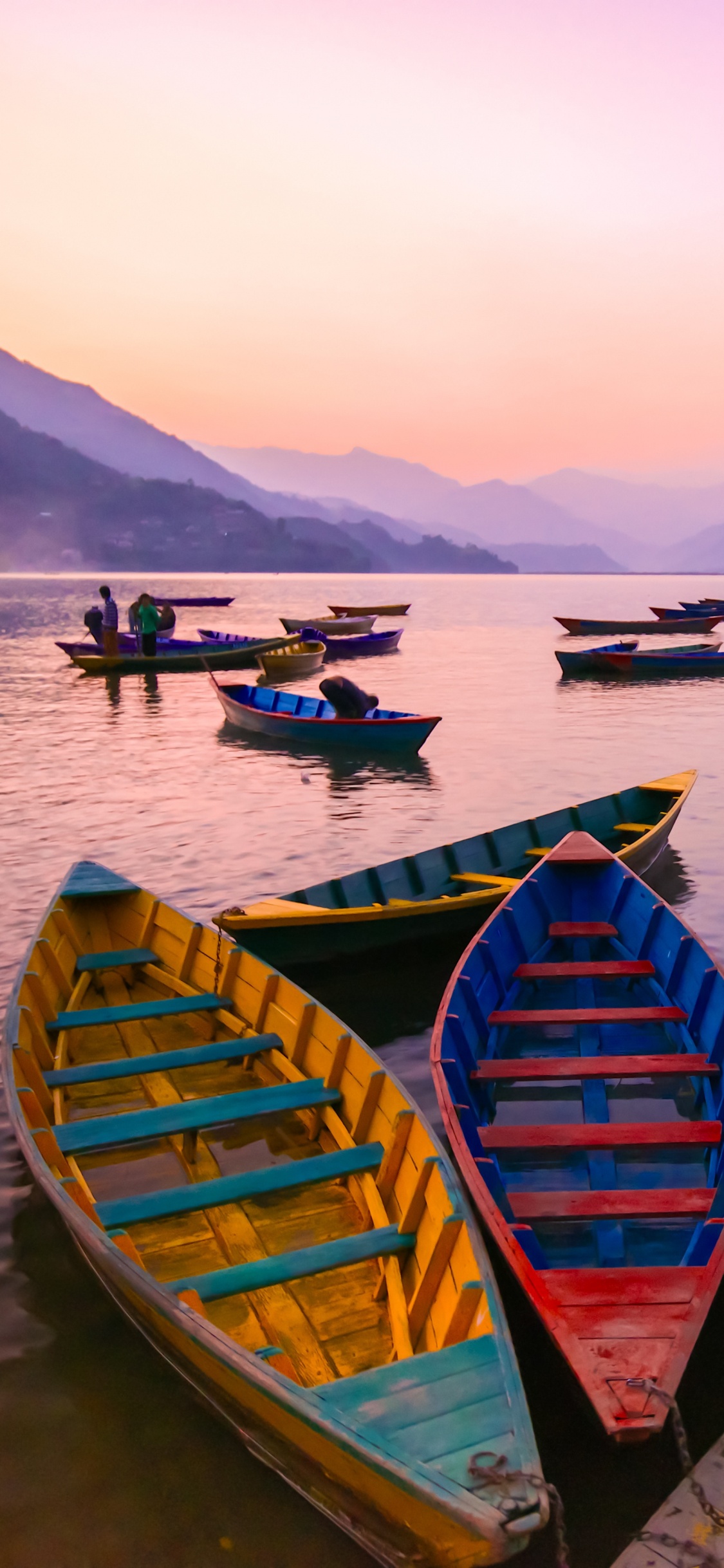 Blue and Green Wooden Boats on Body of Water During Daytime. Wallpaper in 1125x2436 Resolution