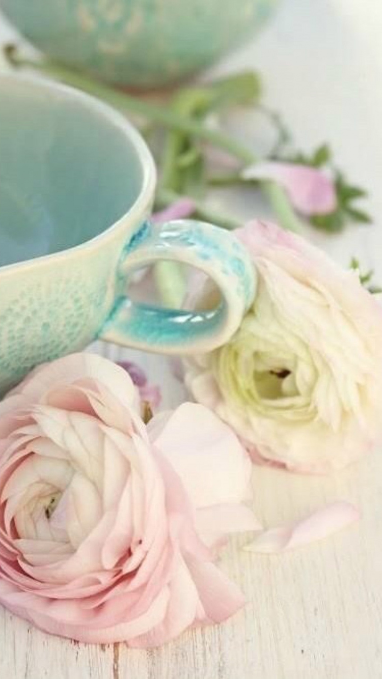 White and Blue Floral Ceramic Teacup on Saucer Beside Pink Roses. Wallpaper in 750x1334 Resolution
