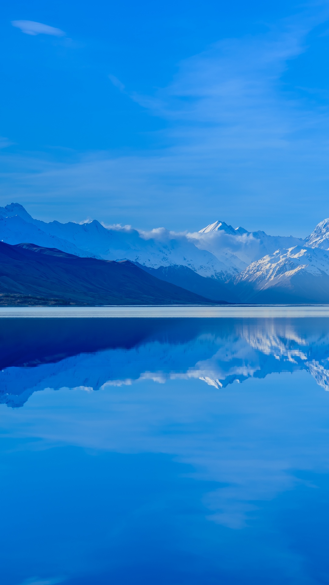 Body of Water Near Mountain Under Blue Sky During Daytime. Wallpaper in 1080x1920 Resolution