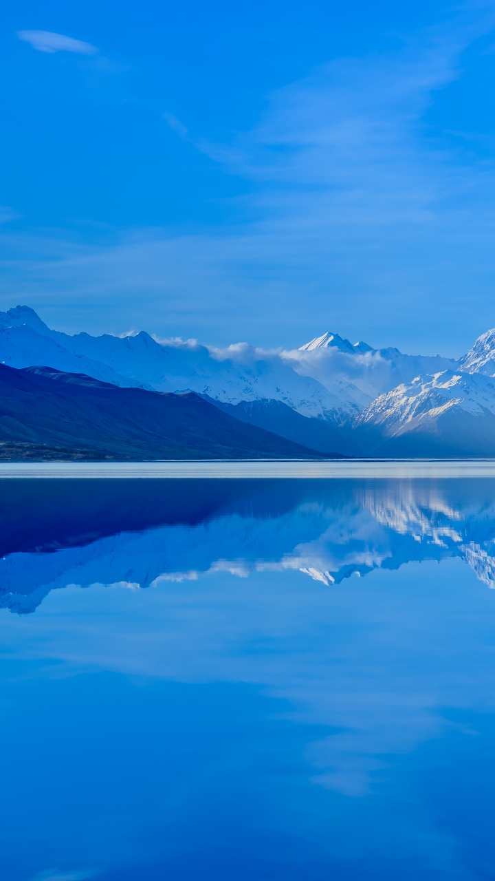 Body of Water Near Mountain Under Blue Sky During Daytime. Wallpaper in 720x1280 Resolution