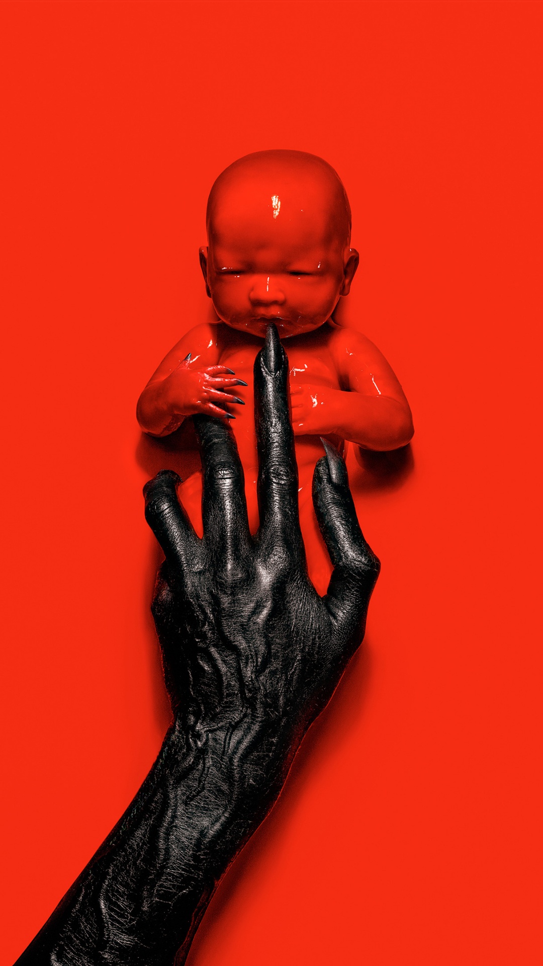 Man in Black Suit Holding a Baby Figurine. Wallpaper in 1080x1920 Resolution