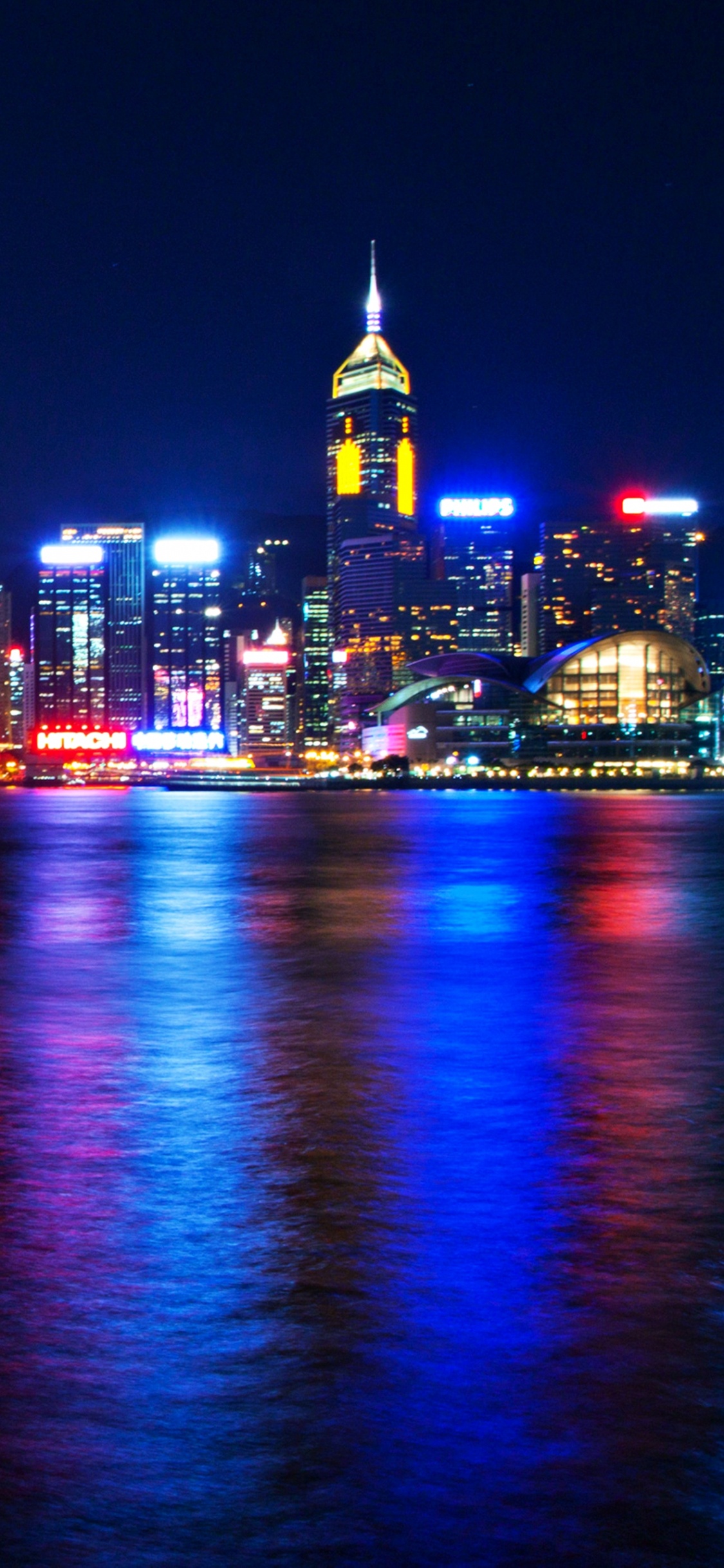 City Skyline During Night Time. Wallpaper in 1125x2436 Resolution