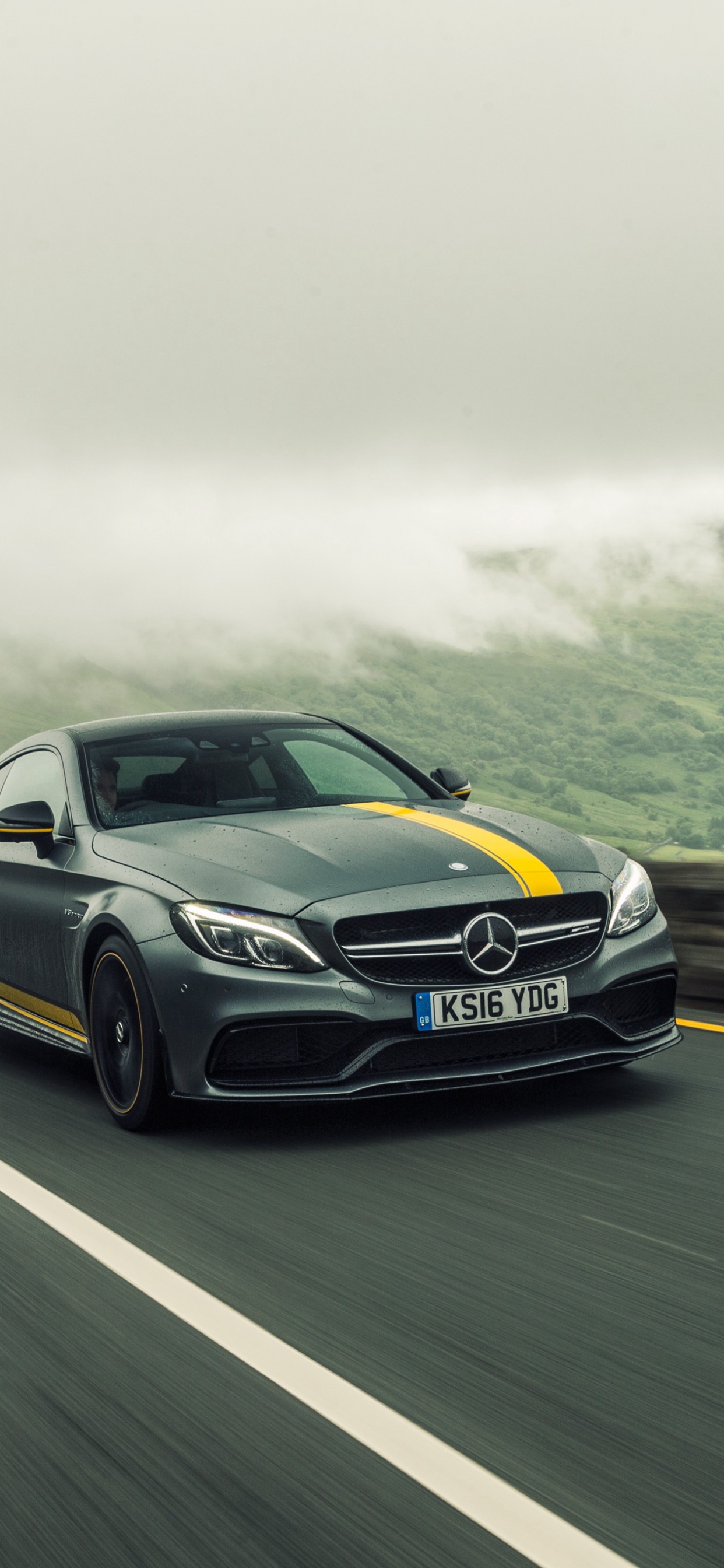 Blaues Audi Coupe Tagsüber Unterwegs. Wallpaper in 1242x2688 Resolution