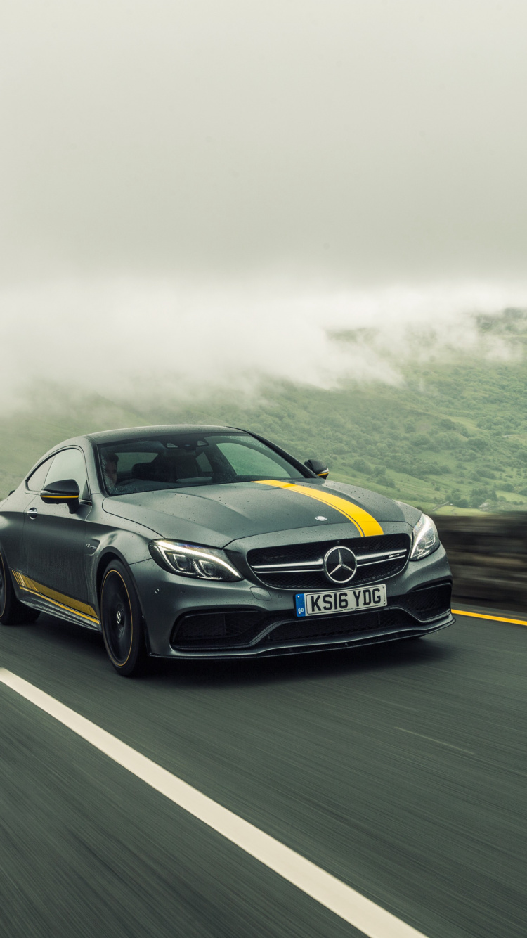 Blaues Audi Coupe Tagsüber Unterwegs. Wallpaper in 750x1334 Resolution