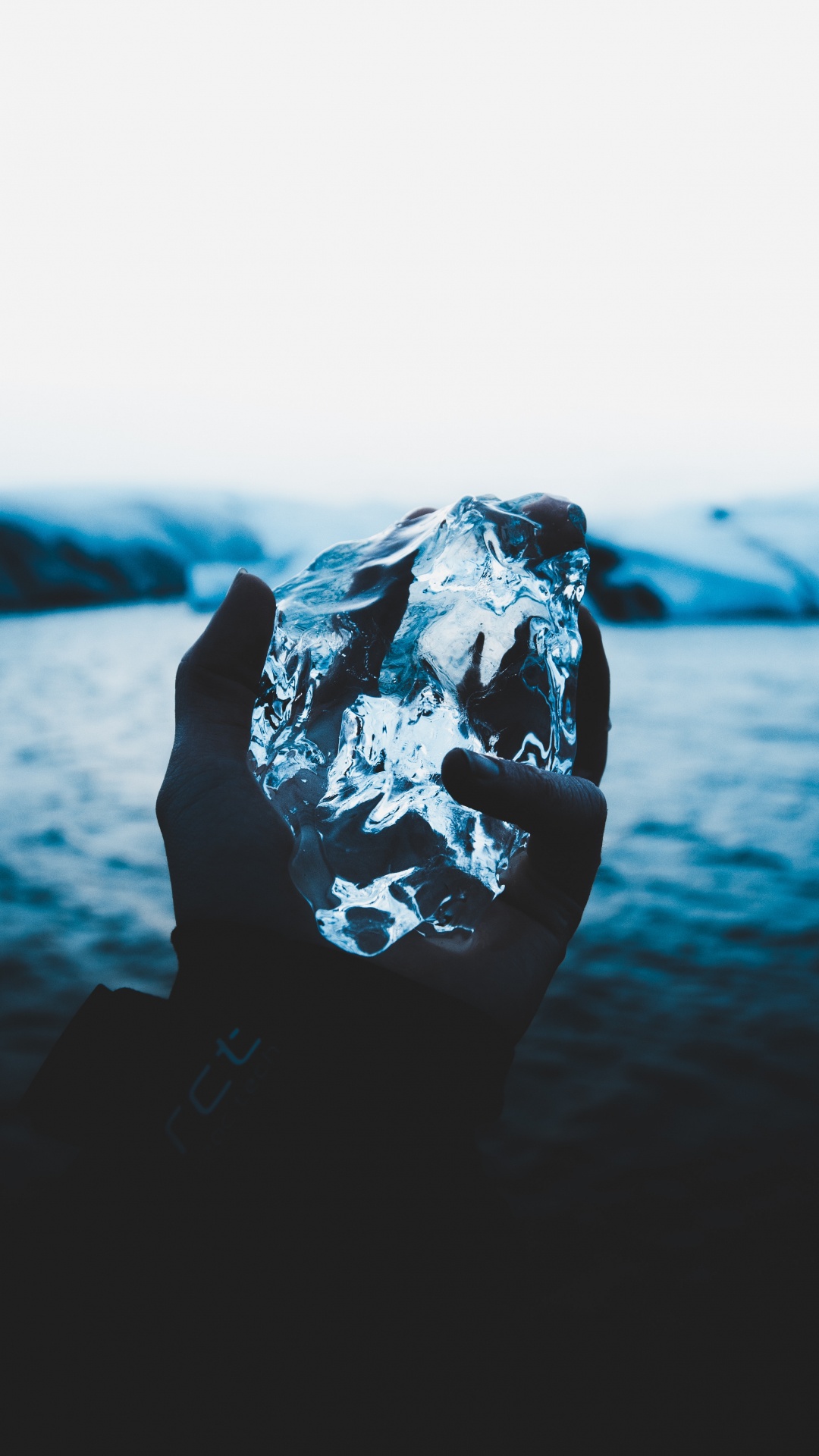 Person Holding Ice on The Air. Wallpaper in 1080x1920 Resolution