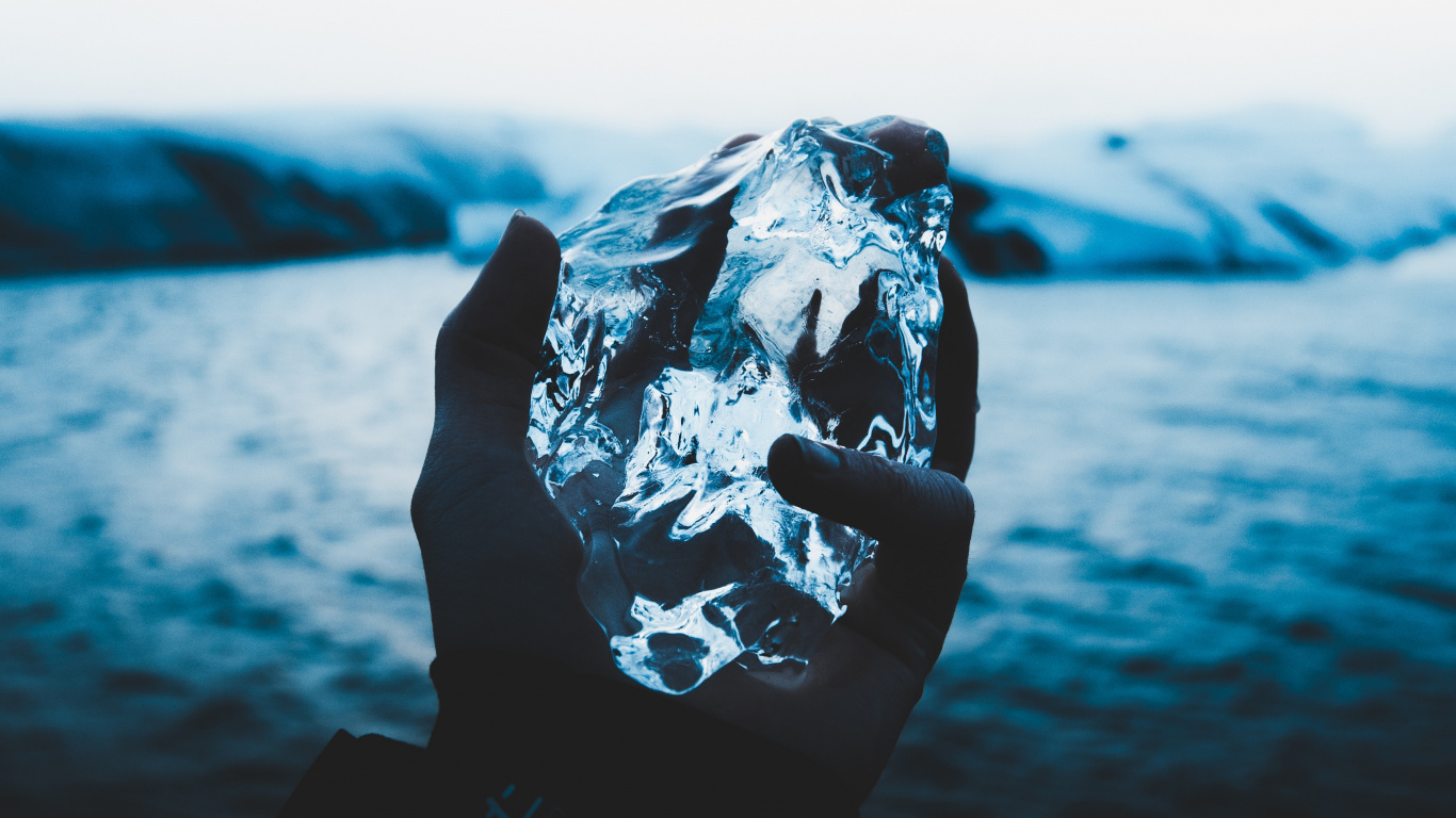 Person Holding Ice on The Air. Wallpaper in 1366x768 Resolution