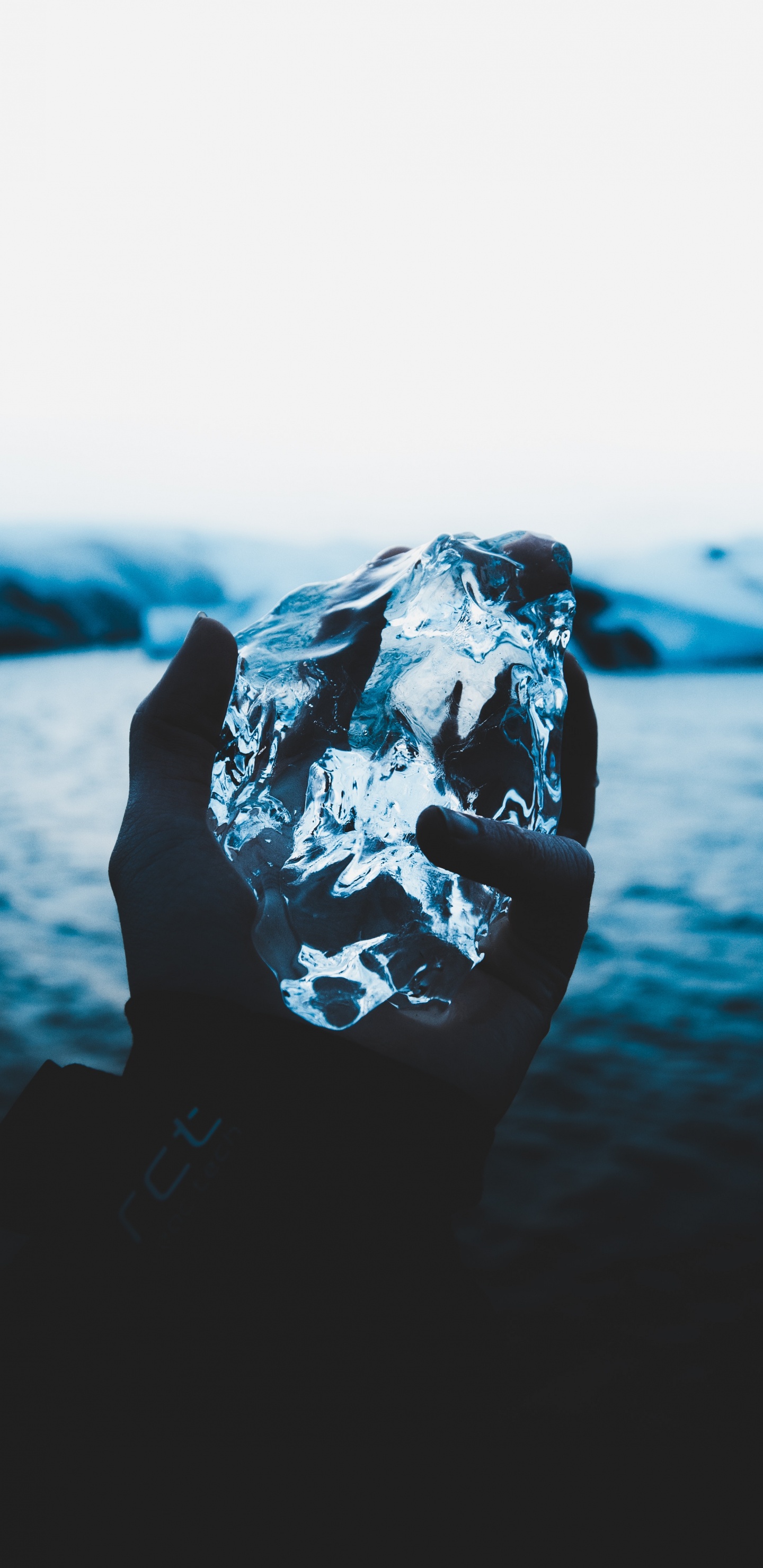 Person Holding Ice on The Air. Wallpaper in 1440x2960 Resolution