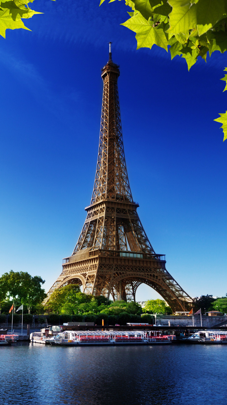 Eiffel Tower Near Body of Water During Daytime. Wallpaper in 750x1334 Resolution