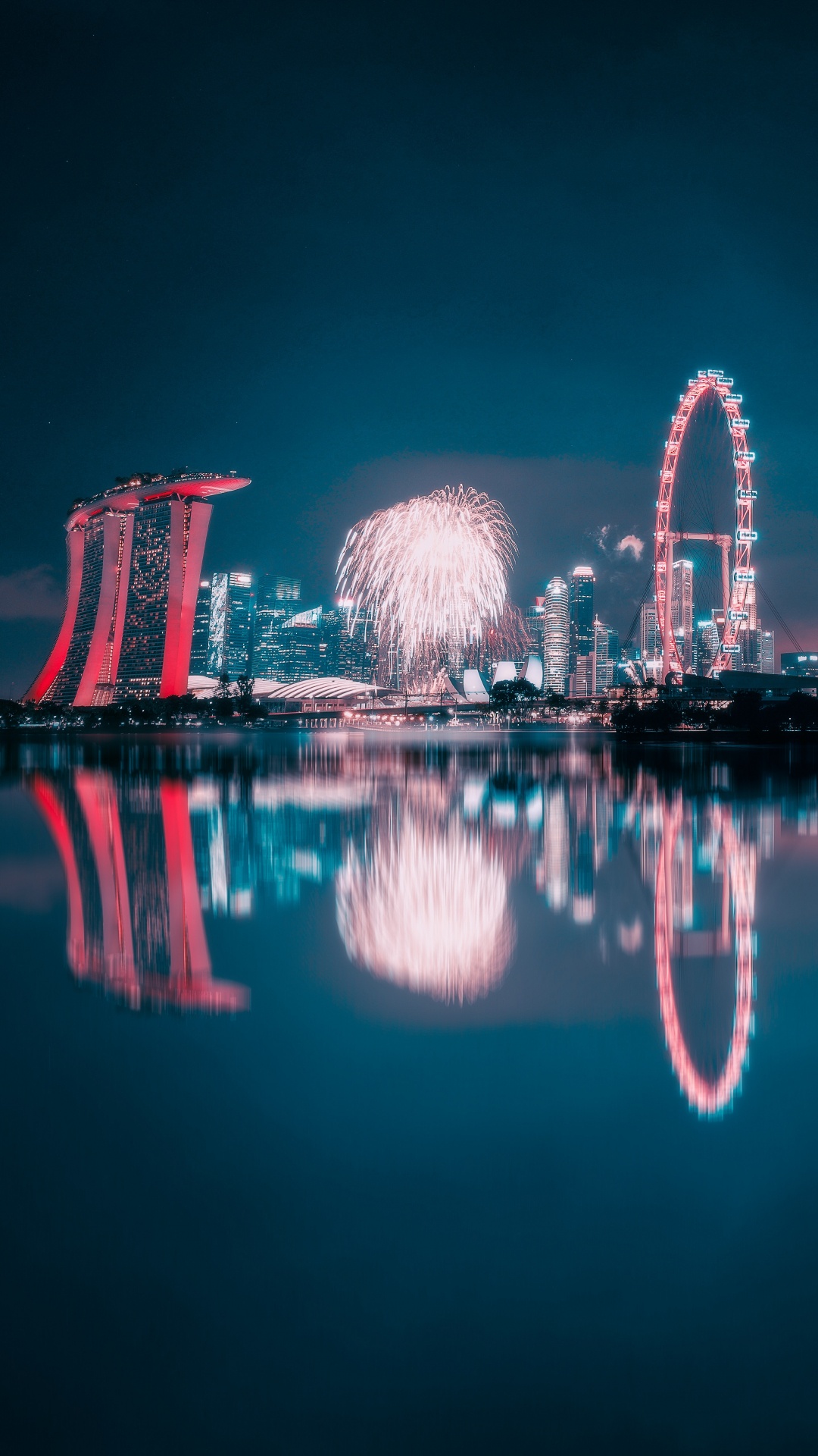 Fireworks Display Over Body of Water During Night Time. Wallpaper in 1080x1920 Resolution