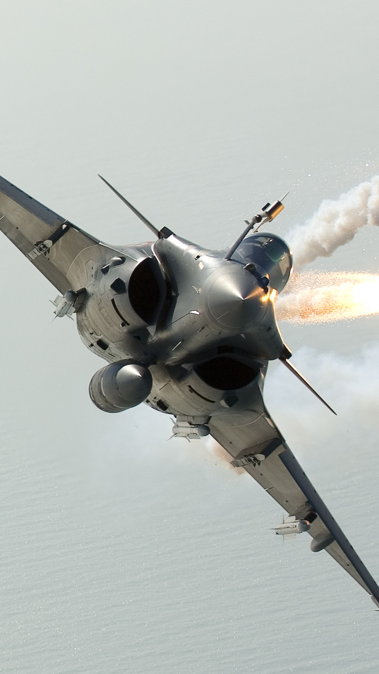 Gray Jet Plane in Mid Air. Wallpaper in 750x1334 Resolution