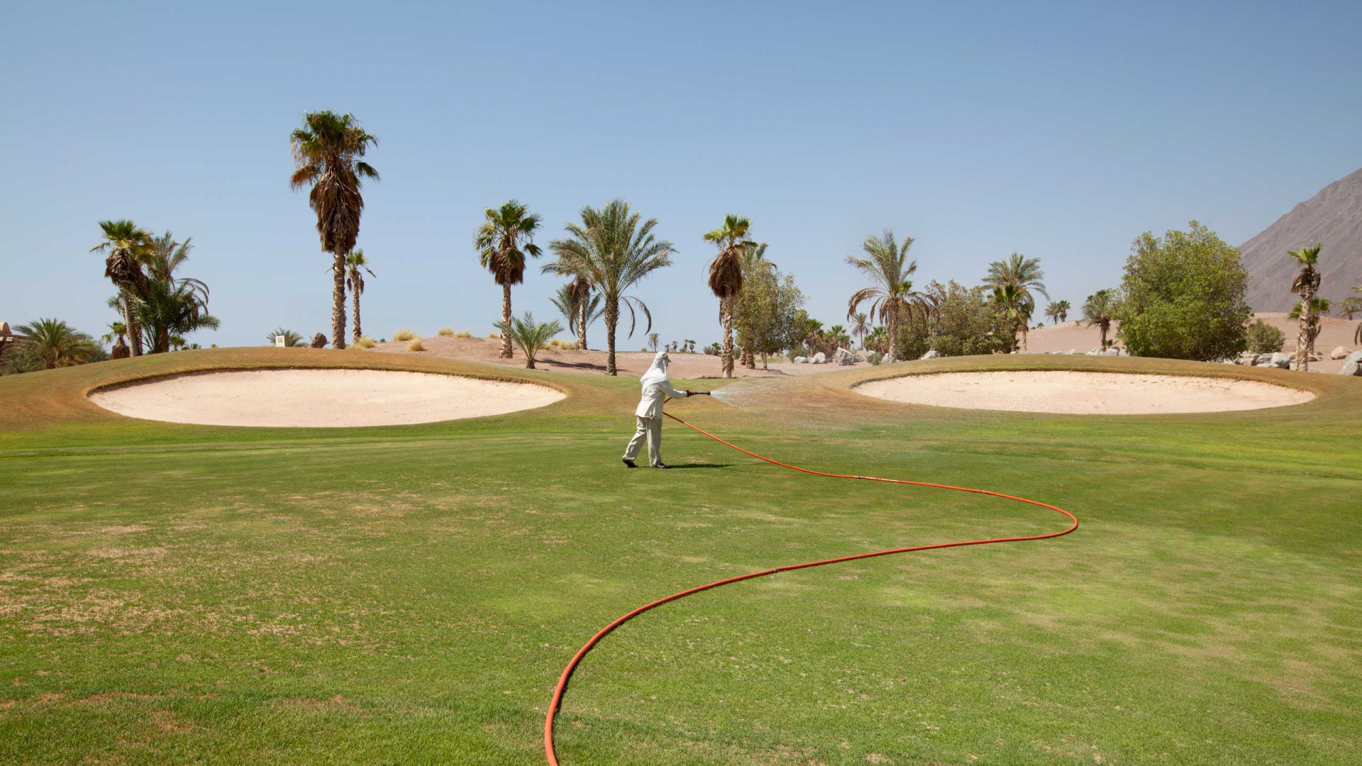 Man in White Shirt and Pants Standing on Green Grass Field During Daytime. Wallpaper in 1920x1080 Resolution