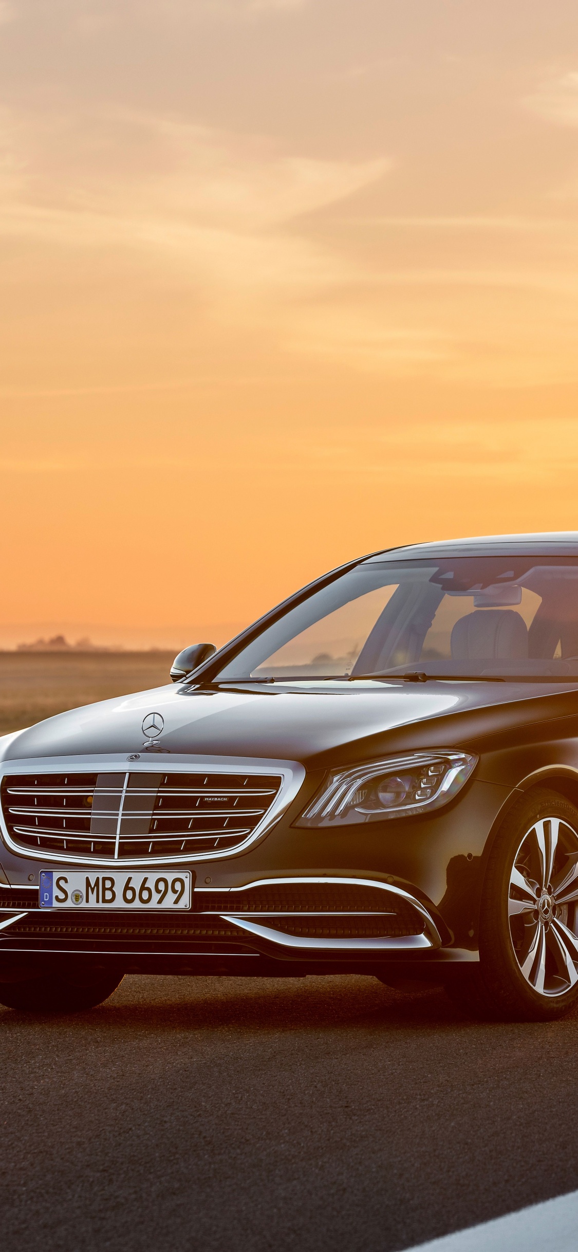 Black Mercedes Benz Sedan on Road During Daytime. Wallpaper in 1125x2436 Resolution