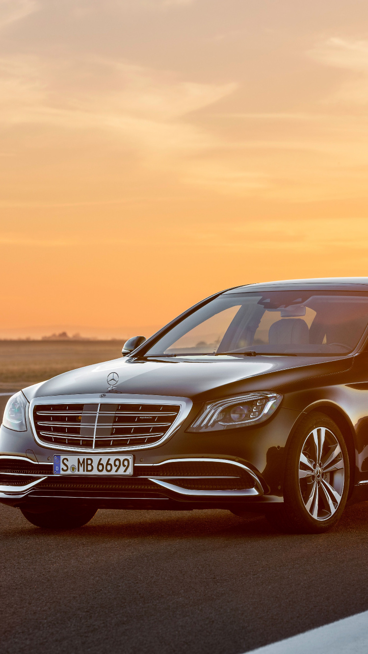 Black Mercedes Benz Sedan on Road During Daytime. Wallpaper in 750x1334 Resolution