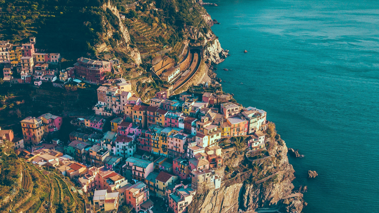 Aerial View of City Near Body of Water During Daytime. Wallpaper in 1280x720 Resolution