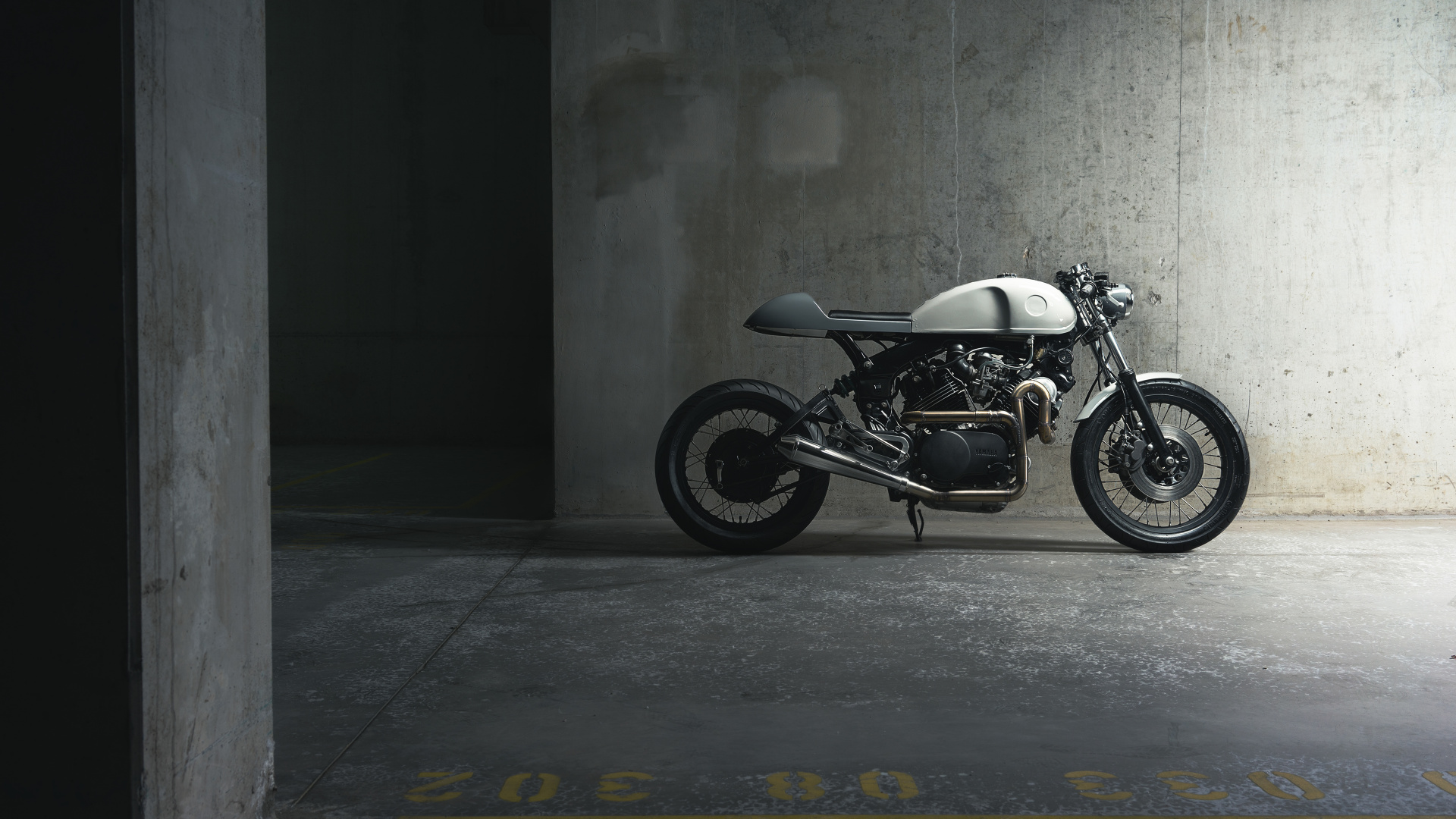 Black and Silver Motorcycle Parked Beside Gray Wall. Wallpaper in 1920x1080 Resolution
