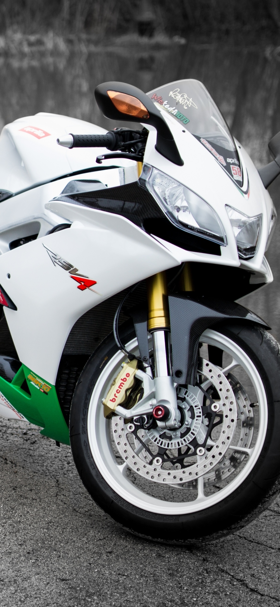 White and Black Sports Bike on Road During Daytime. Wallpaper in 1125x2436 Resolution