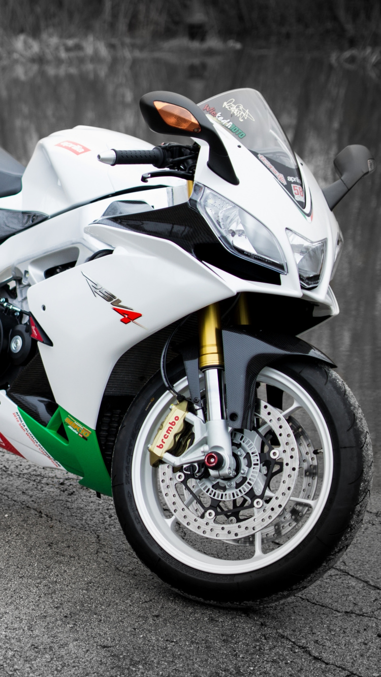 White and Black Sports Bike on Road During Daytime. Wallpaper in 750x1334 Resolution