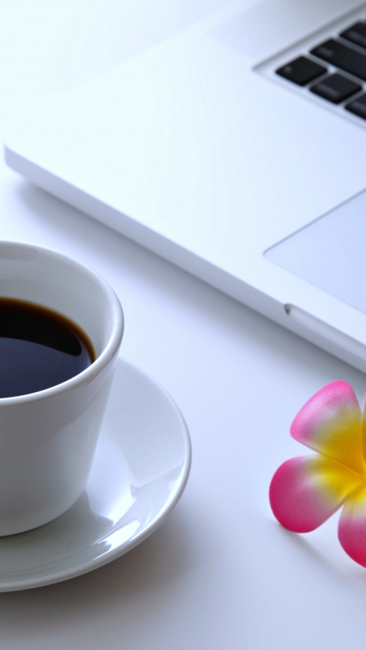 White Ceramic Cup on White Saucer Beside Macbook Pro. Wallpaper in 720x1280 Resolution