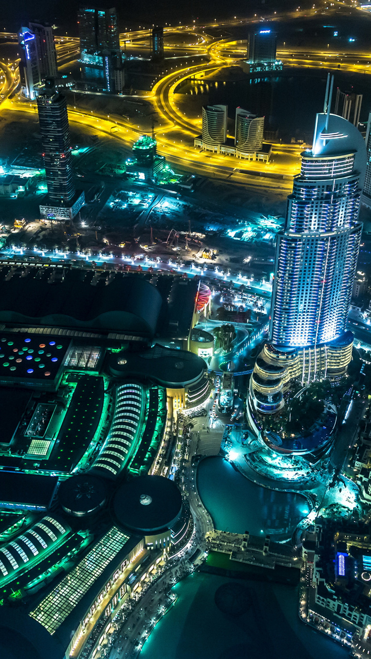 Aerial View of City Buildings During Night Time. Wallpaper in 750x1334 Resolution