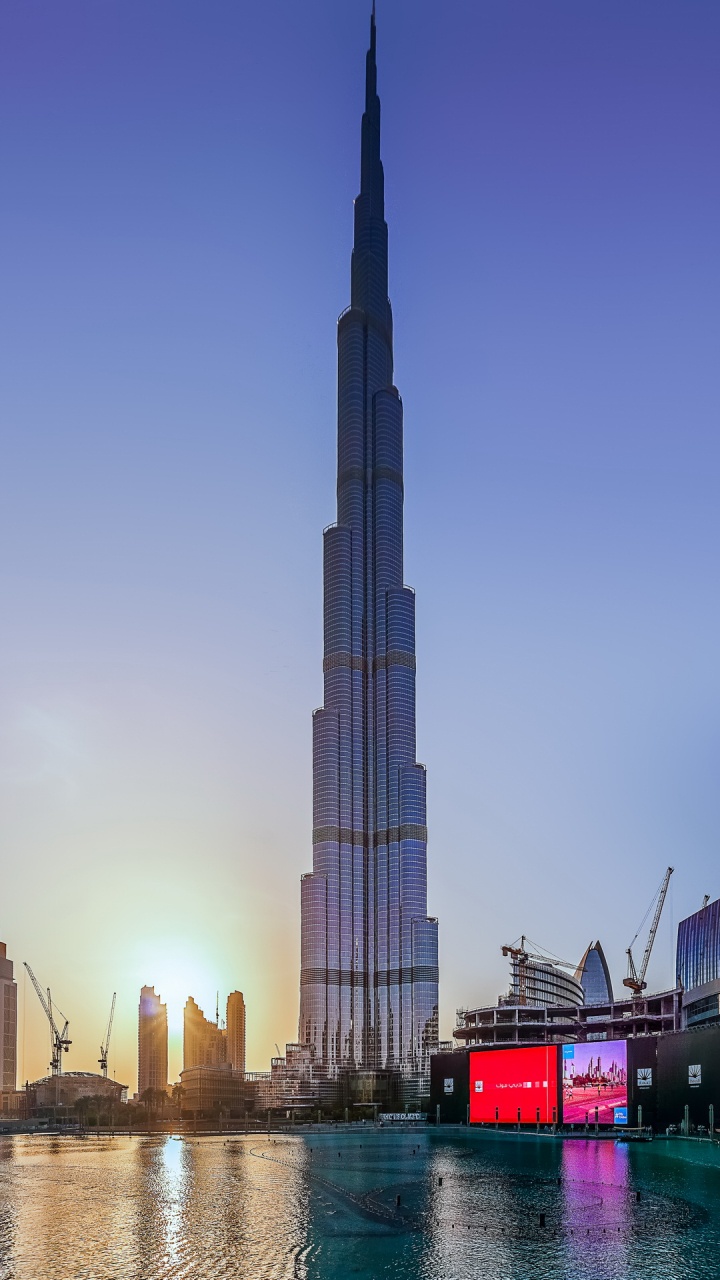 City Buildings Near Body of Water During Daytime. Wallpaper in 720x1280 Resolution