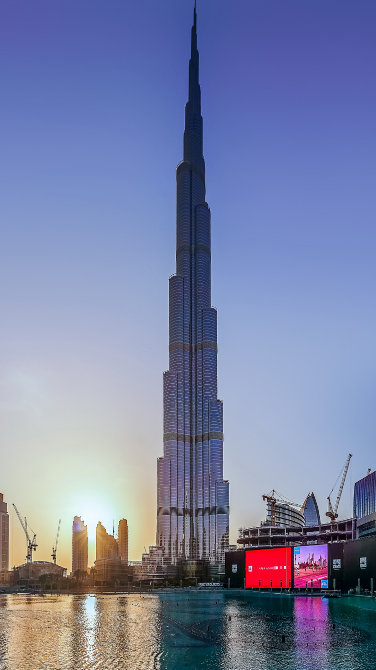 City Buildings Near Body of Water During Daytime. Wallpaper in 750x1334 Resolution