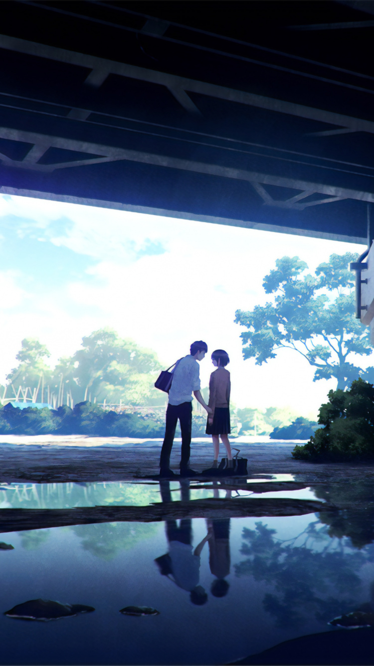 Hombre Con Camisa Negra de Pie Sobre el Puente de Hormigón Gris Durante el Día. Wallpaper in 750x1334 Resolution