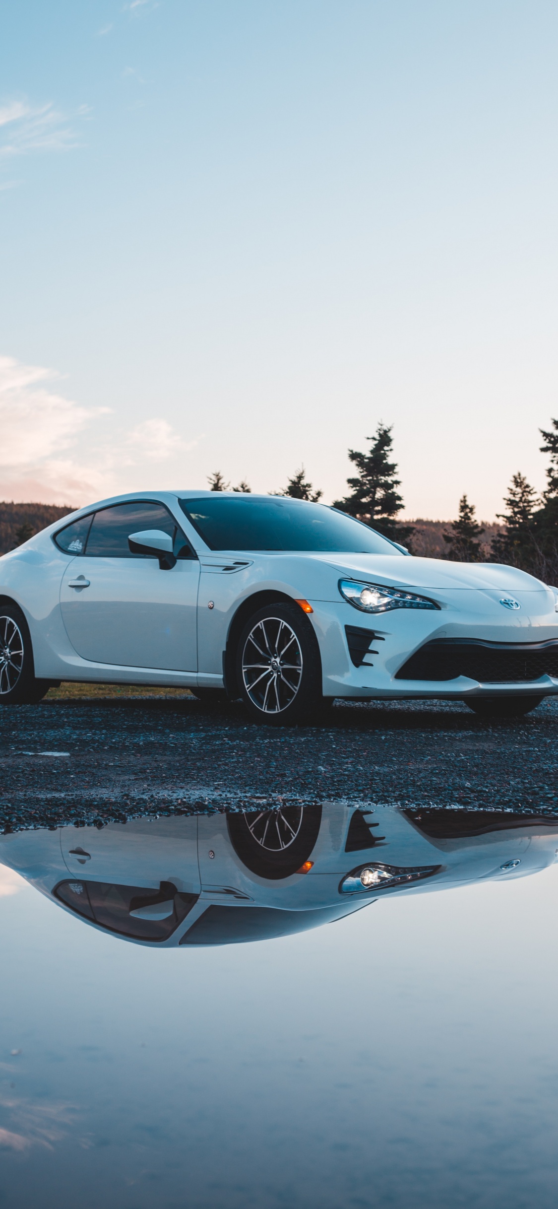 White Porsche 911 on Road During Daytime. Wallpaper in 1125x2436 Resolution