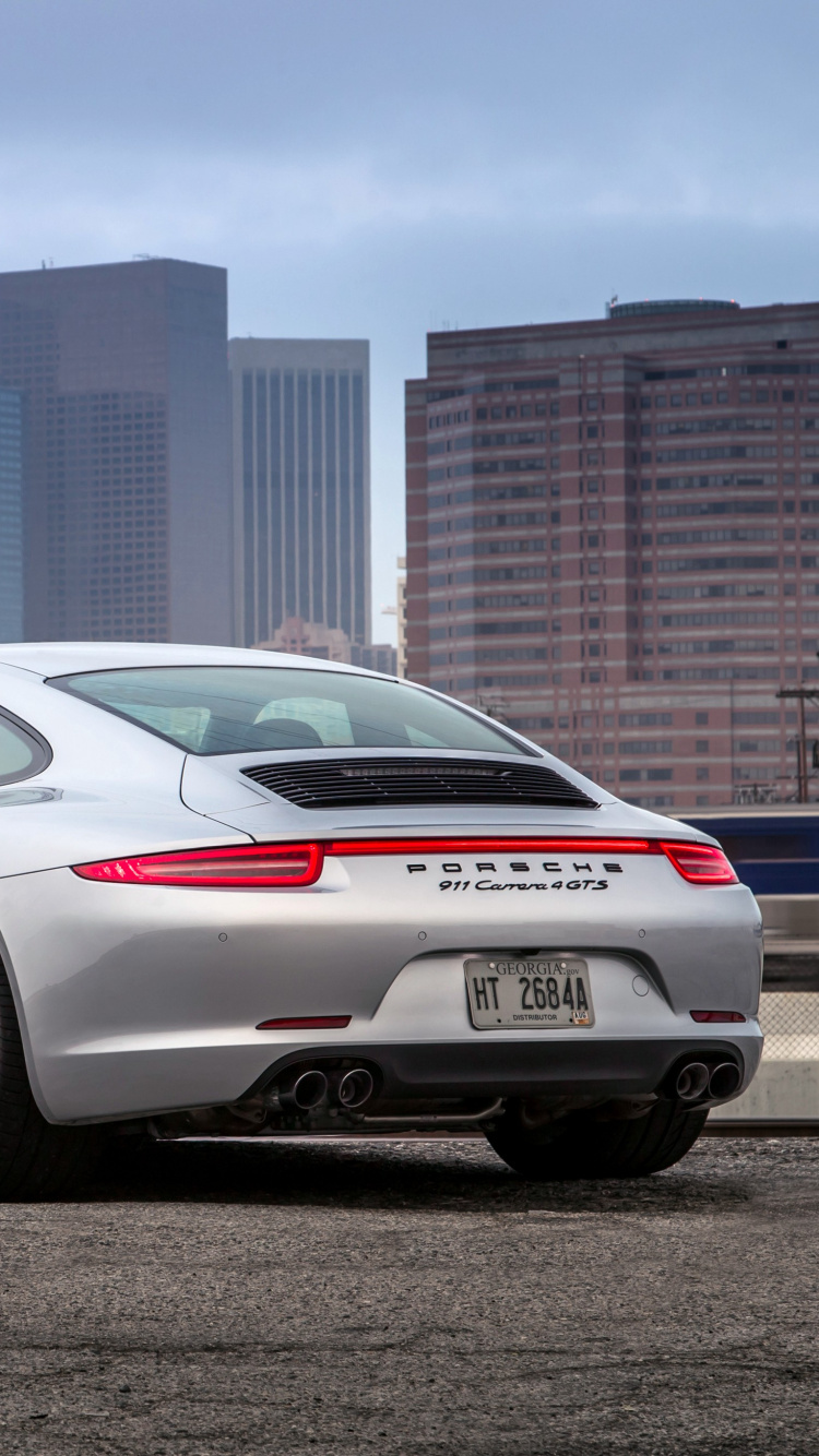 Porsche 911 Blanche Garée Près D'une Clôture Métallique Bleue Pendant la Journée. Wallpaper in 750x1334 Resolution