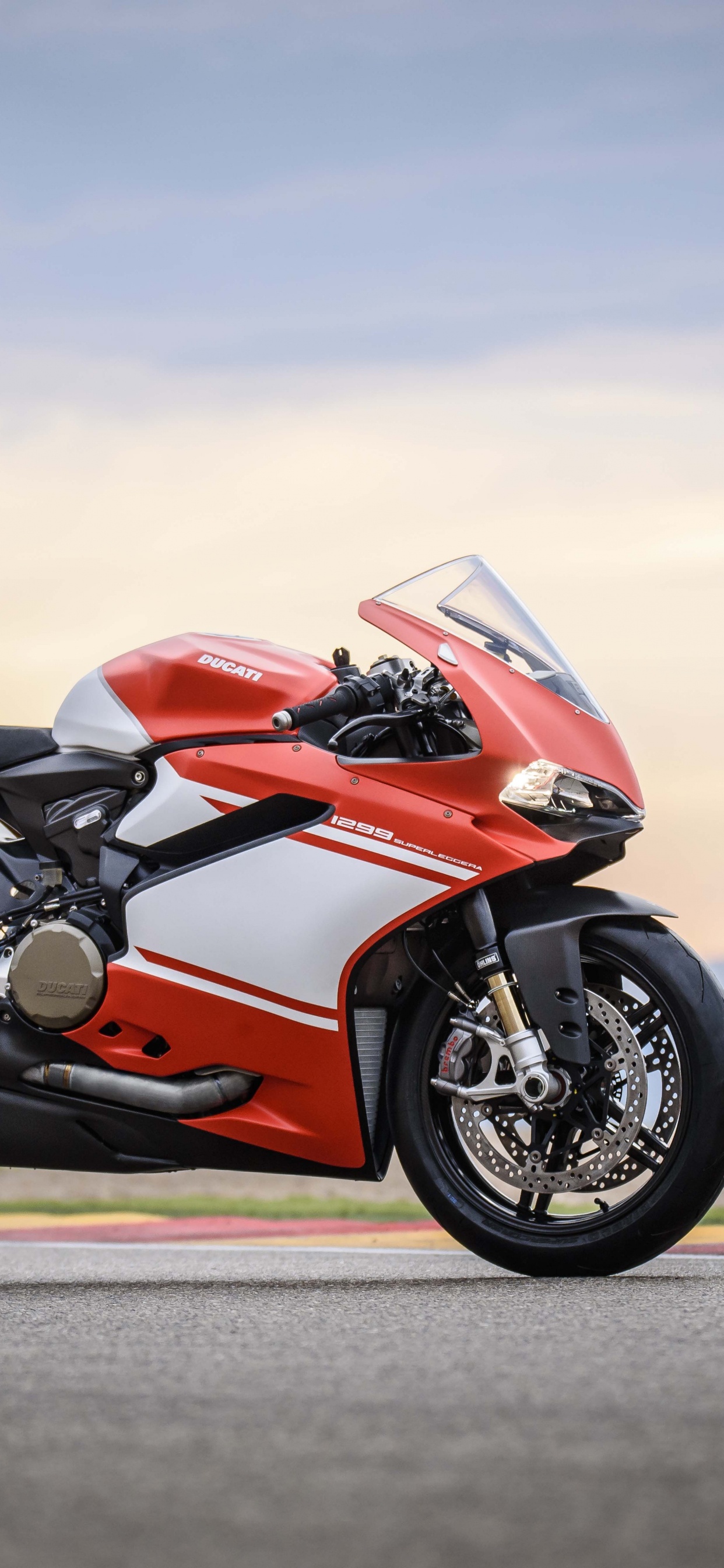 Red and Black Sports Bike on Road During Daytime. Wallpaper in 1242x2688 Resolution