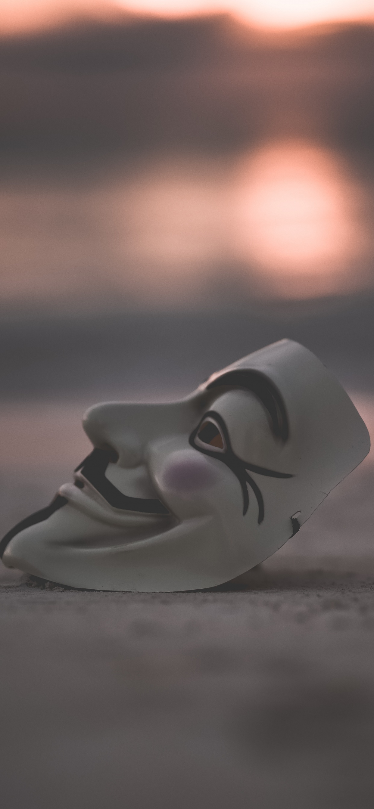 White Ceramic Figurine on Brown Sand. Wallpaper in 1242x2688 Resolution
