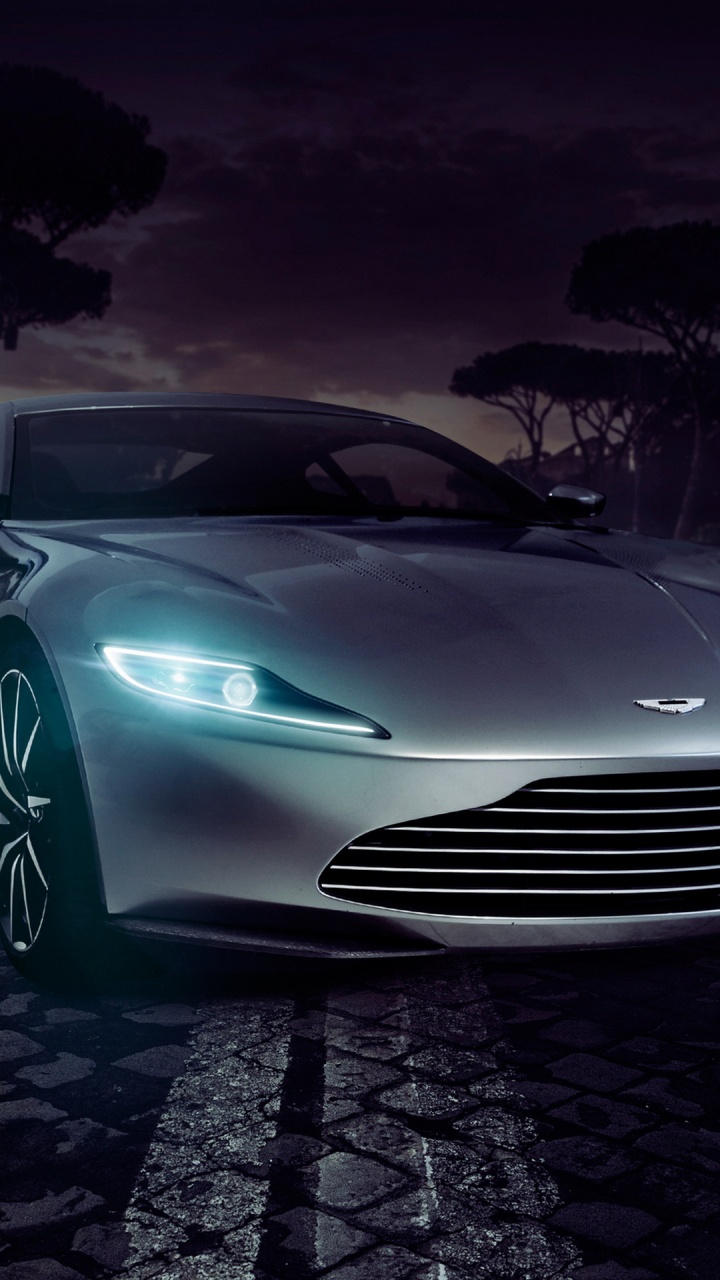 Porsche 911 Argent Sur la Chaussée de Briques Grises. Wallpaper in 720x1280 Resolution