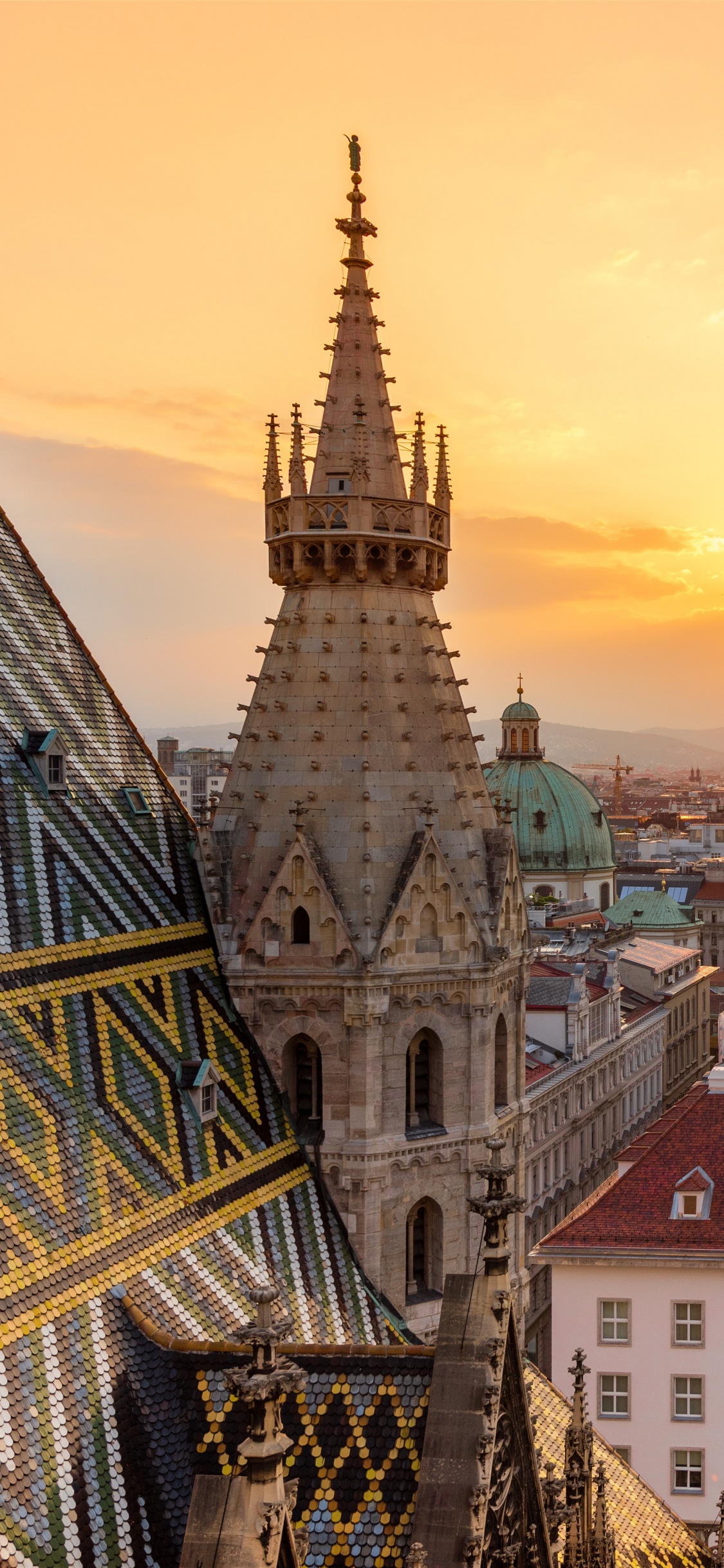 Aerial View of City Buildings During Sunset. Wallpaper in 1125x2436 Resolution