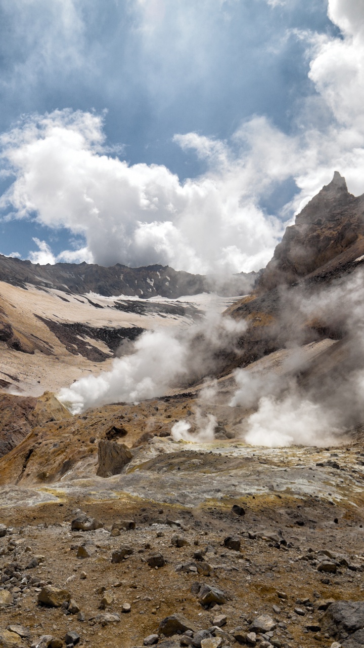 Brown and Gray Mountains Under White Clouds and Blue Sky During Daytime. Wallpaper in 720x1280 Resolution