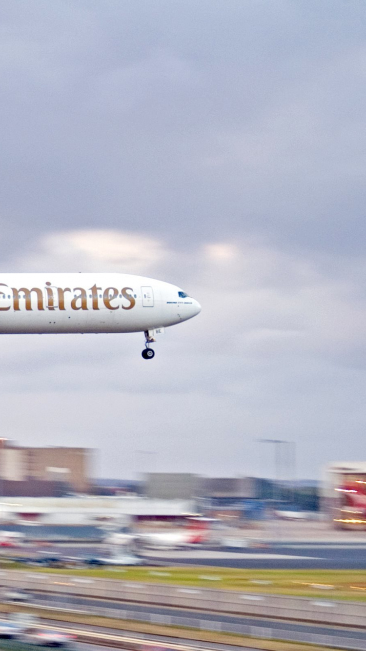White and Red Air Plane in The Sky During Daytime. Wallpaper in 750x1334 Resolution