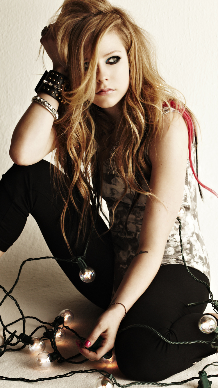 Woman in Black and White Dress Sitting on Floor. Wallpaper in 750x1334 Resolution