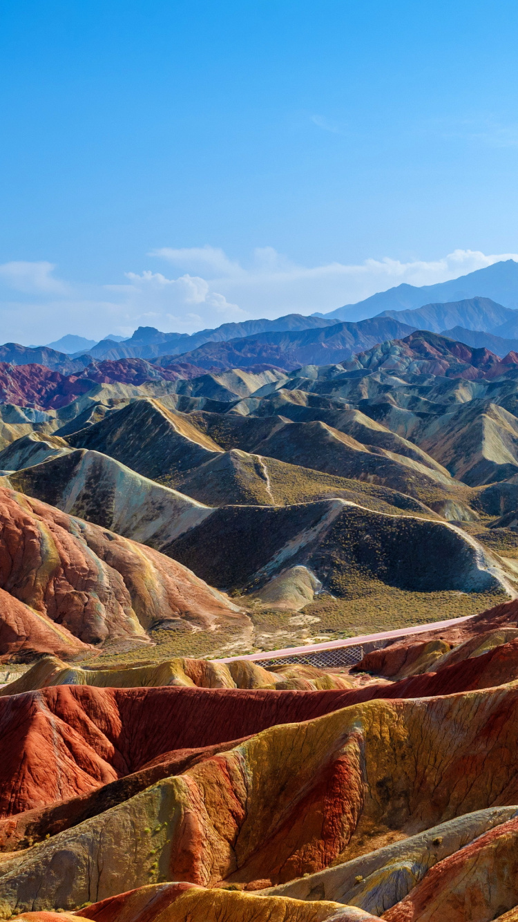 Brown and Gray Mountains Under Blue Sky During Daytime. Wallpaper in 750x1334 Resolution