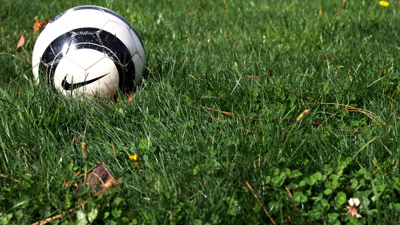 White and Black Soccer Ball on Green Grass Field. Wallpaper in 1280x720 Resolution