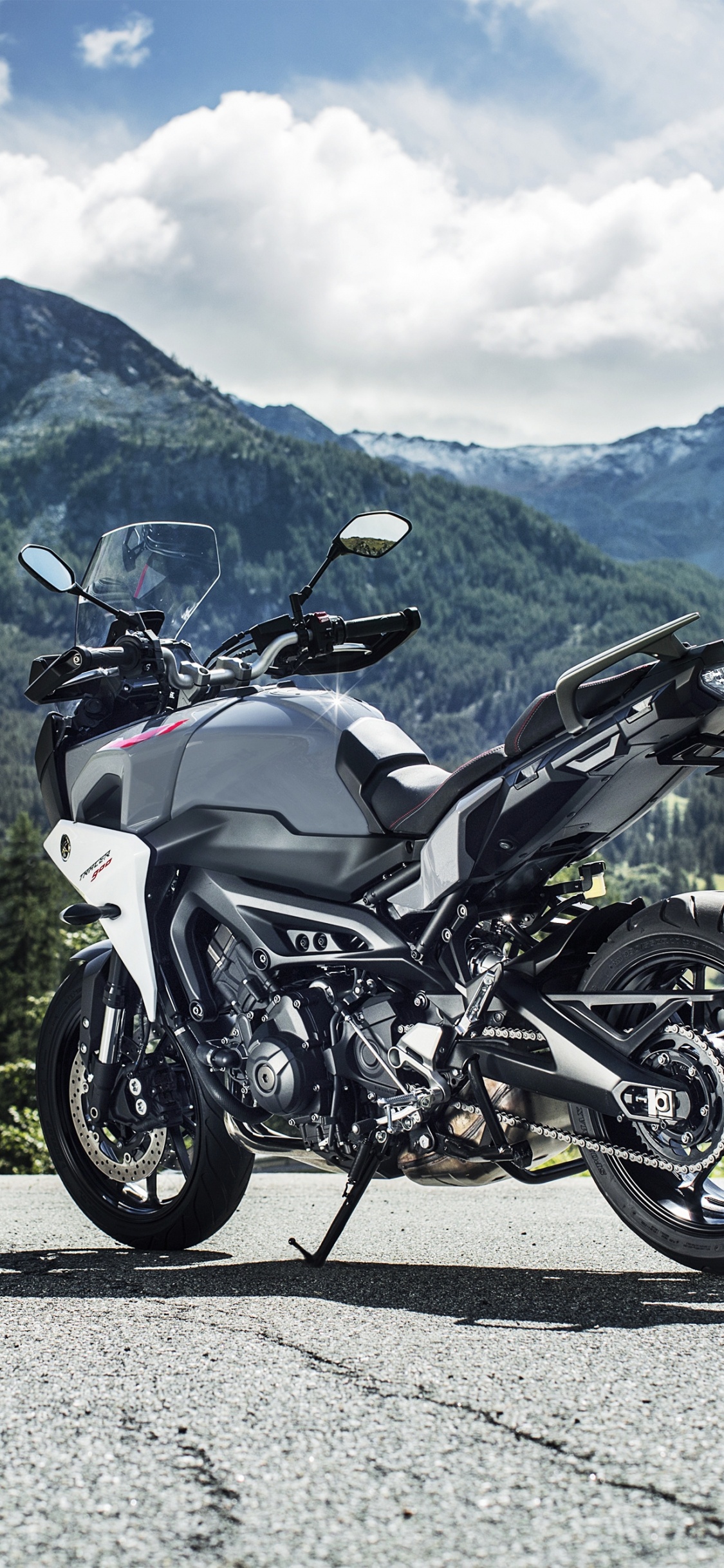 Black and Gray Sports Bike on Gray Asphalt Road During Daytime. Wallpaper in 1125x2436 Resolution