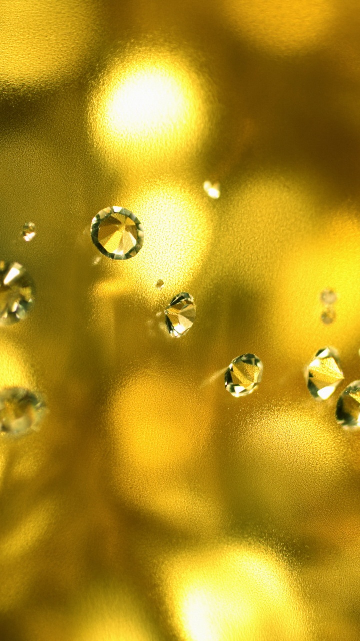 Water Droplets on Yellow Light. Wallpaper in 720x1280 Resolution