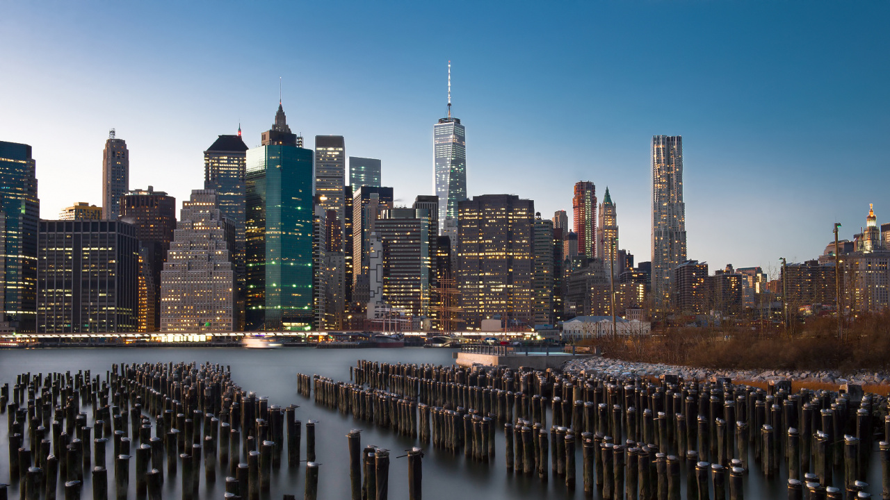 City Skyline Across Body of Water During Night Time. Wallpaper in 1280x720 Resolution