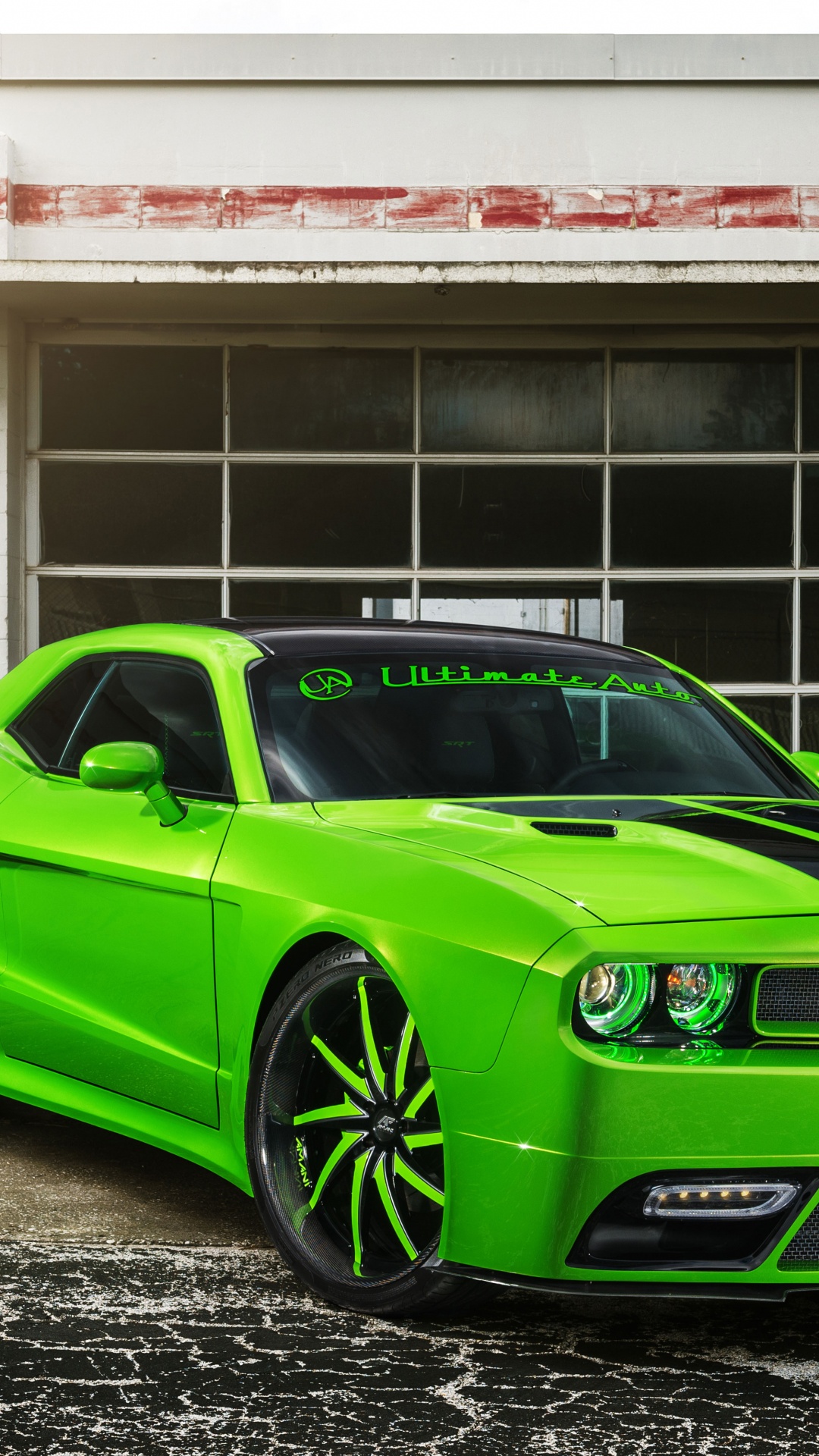 Green Chevrolet Camaro Parked Beside White Concrete Building During Daytime. Wallpaper in 1080x1920 Resolution