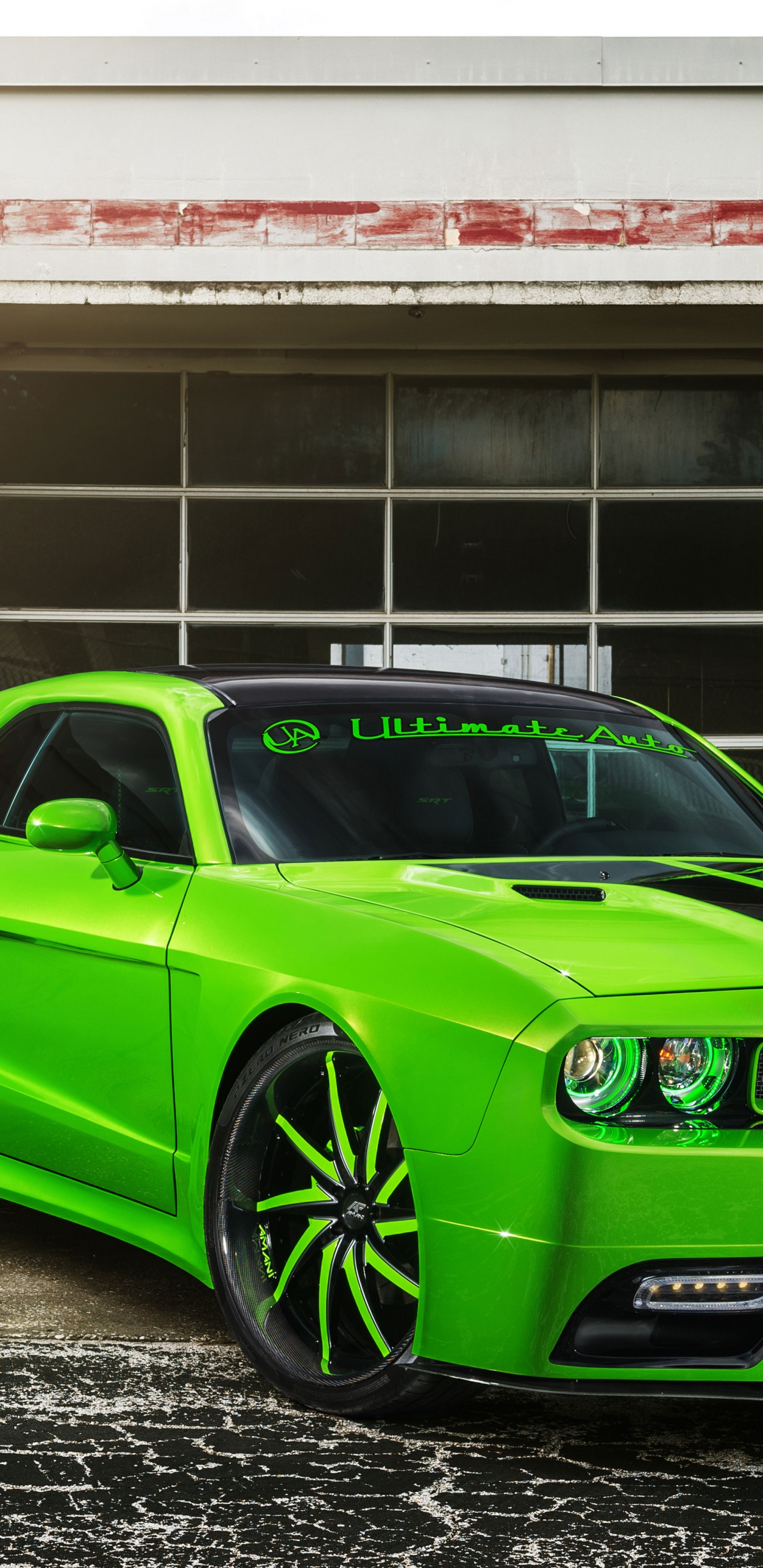 Green Chevrolet Camaro Parked Beside White Concrete Building During Daytime. Wallpaper in 1440x2960 Resolution