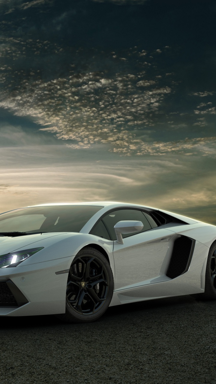 White Lamborghini Aventador on Gray Asphalt Road Under Blue and White Sunny Cloudy Sky. Wallpaper in 720x1280 Resolution