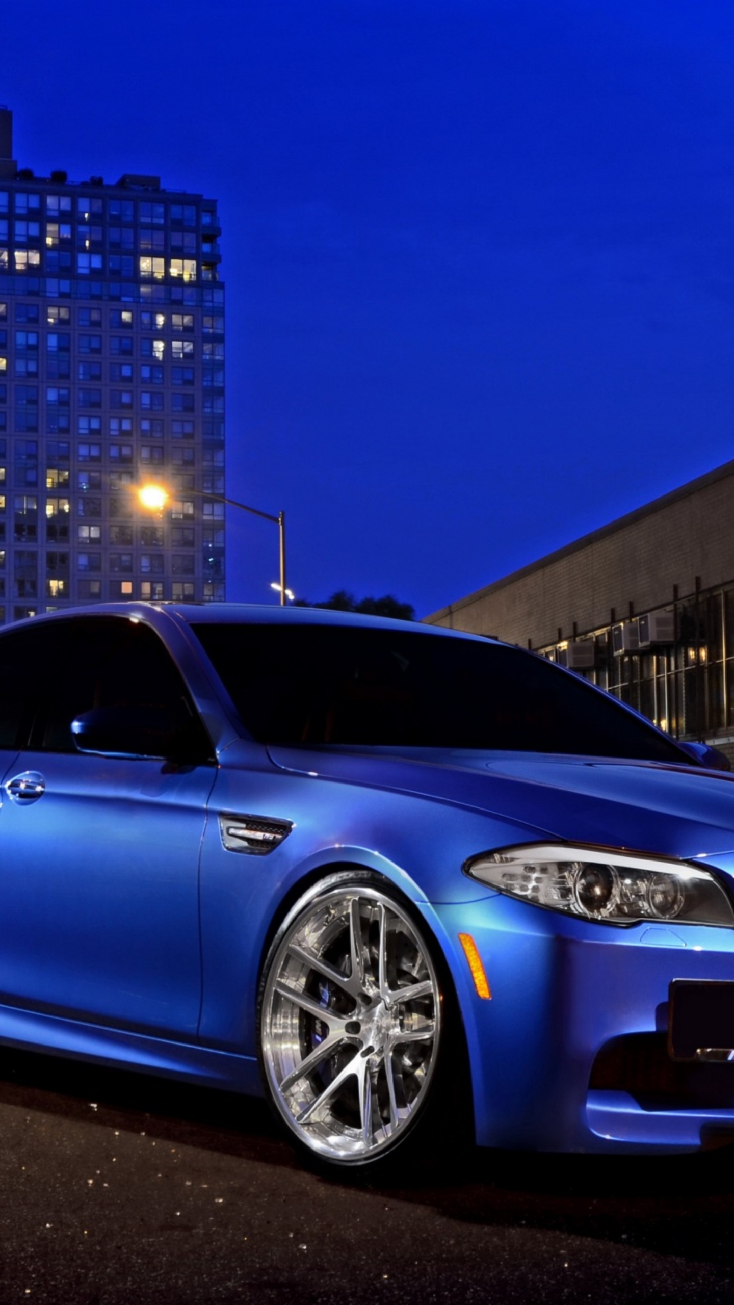 Blue Bmw m 3 Coupe Parked on Parking Lot During Night Time. Wallpaper in 1440x2560 Resolution