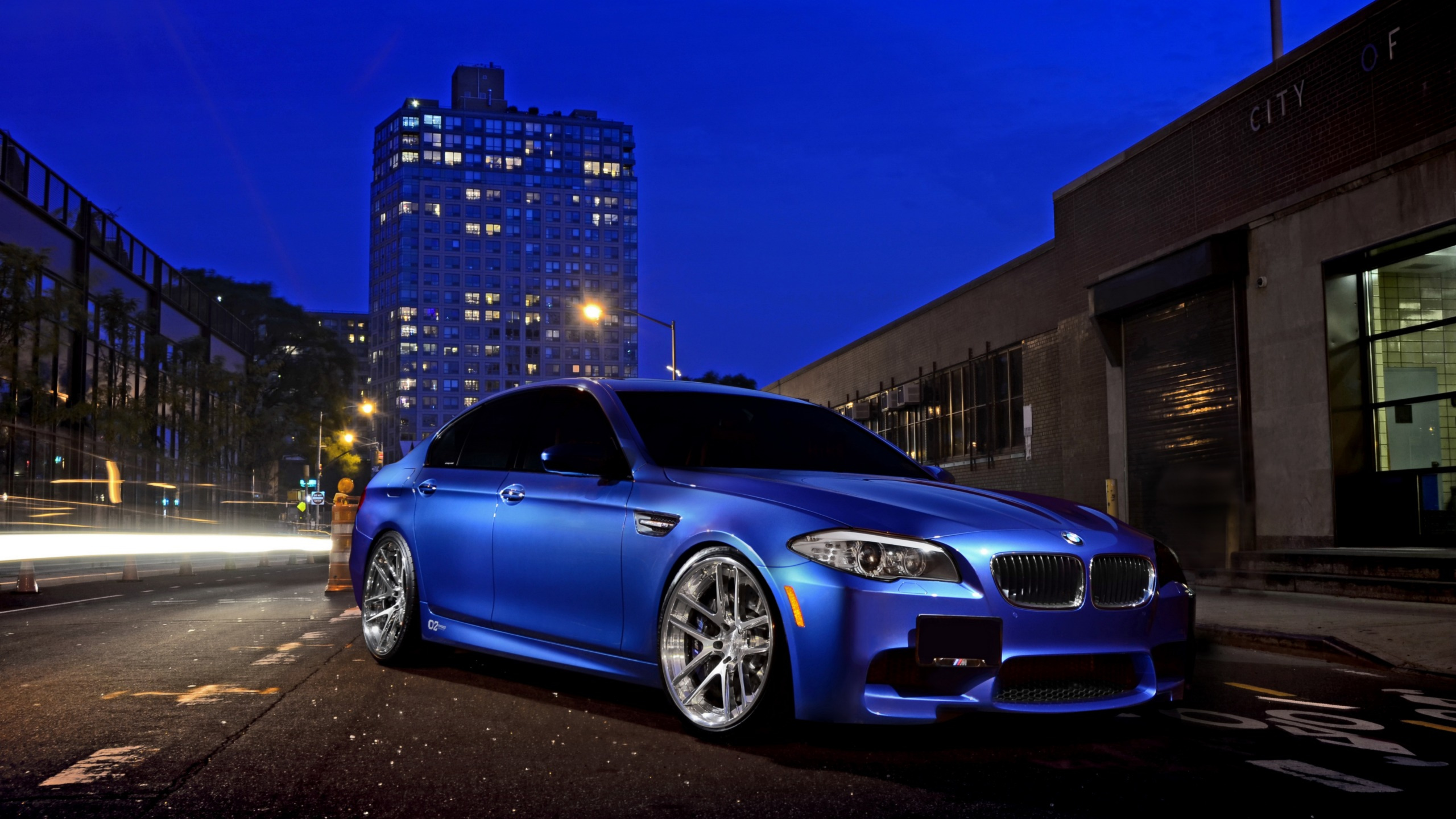 Blue Bmw m 3 Coupe Parked on Parking Lot During Night Time. Wallpaper in 2560x1440 Resolution